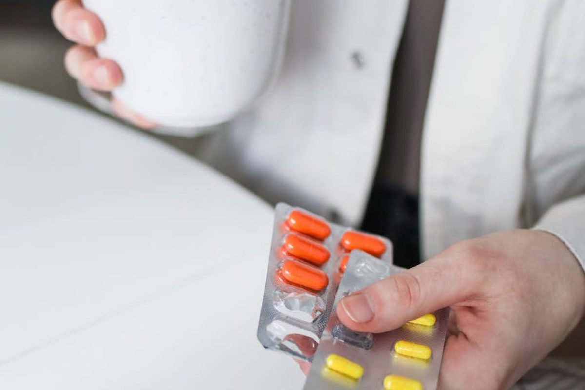 person holding blister packs